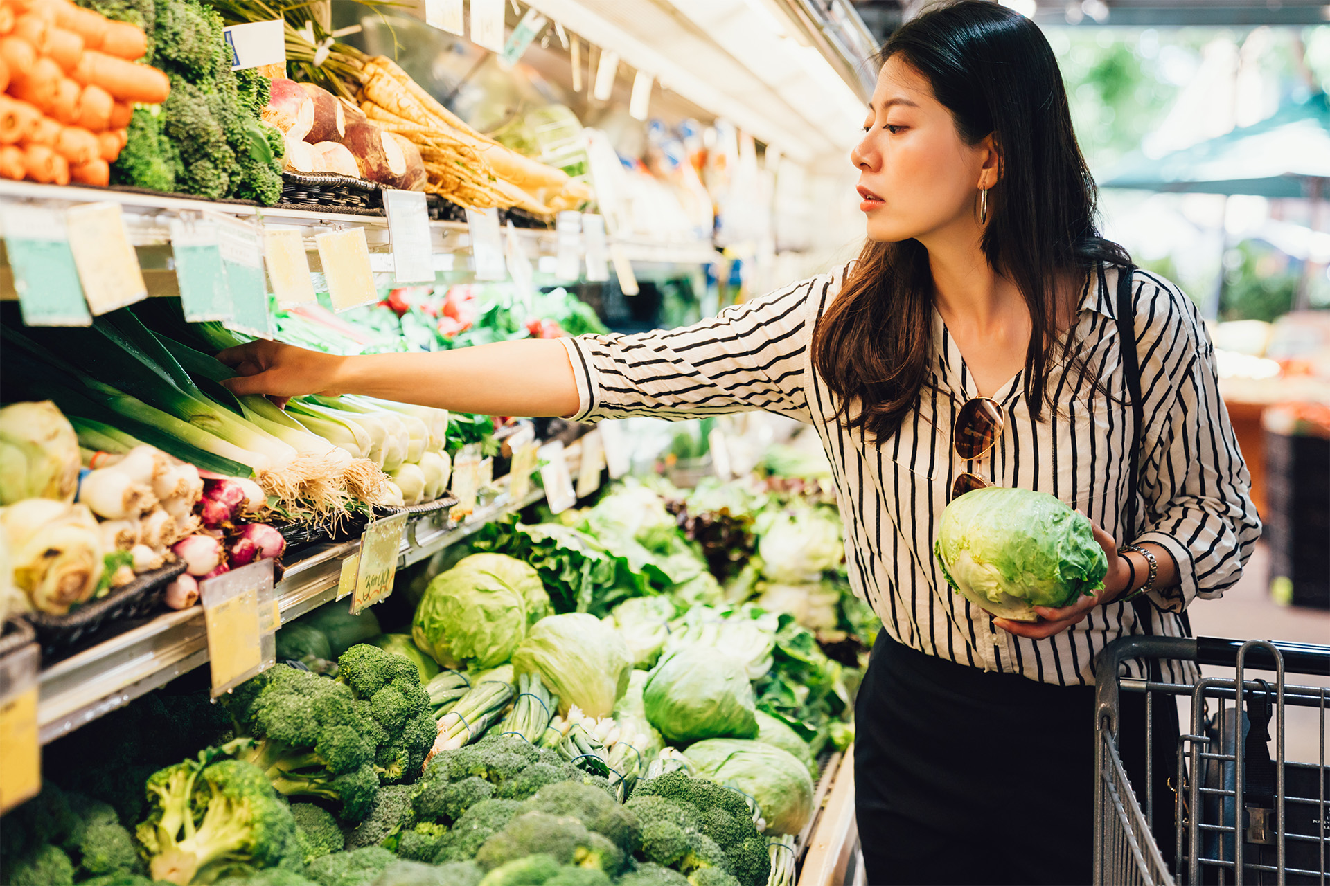 A woman shopping at a grocery store